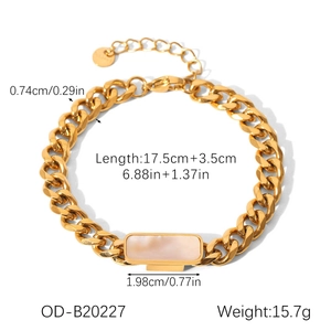 Detail view of gold Cuban chain bracelet with rectangular mother of pearl inlay and extension
