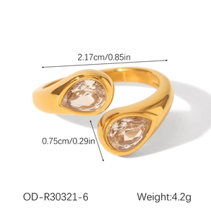 Macro shot of gold bypass ring with dimensions 2.17cm and dual pear-cut crystal settings
