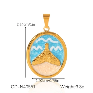 Detailed size and weight specs for a gold whale tail charm with blue enamel waves
