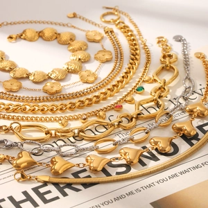 Set of multi-layered 18K gold and silver plated stainless steel bracelets with heart motifs