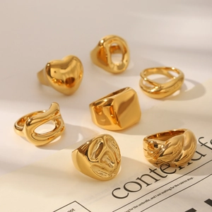 Collection of polished gold stainless steel rings with minimalist geometric patterns