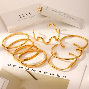 Luxe gold-plated stainless steel bangles set featuring minimalist open and textured designs