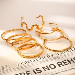 Luxurious gold stainless steel bracelet set with minimalist bamboo and wave designs