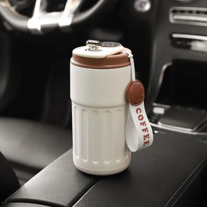 Smart stainless steel coffee mug with LED temperature display and carry strap in car