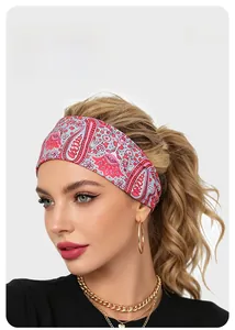 Detail of paisley pattern sports headband worn by a model for skincare and yoga