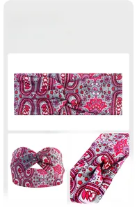 Detail showing the twist design and bohemian paisley print on elastic yoga headband