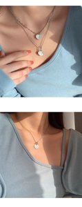 Detail view of double-layered sterling silver heart necklace with unique T-bar toggle clasp