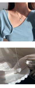 Detail of 925 sterling silver frosted heart necklace featuring stylish OT toggle clasp