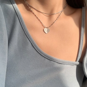 Double-layer 925 silver necklace featuring a frosted glitter heart pendant on model