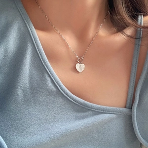 925 Sterling silver heart pendant necklace with OT toggle clasp on a female model