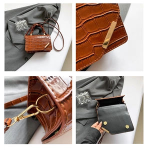 Detail of crocodile embossed leather texture with gold metal buckle and inner structure