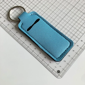 Sky blue neoprene lipstick holder keychain showing metal ring and precise edge stitching