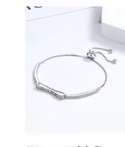 Detail of 925 silver bow bracelet with zircon micro-paving and adjustable slide clasp