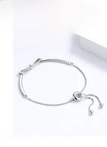 Detail of S925 silver bracelet featuring a zircon bow and adjustable slide clasp