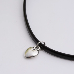 Minimalist S925 silver heart pendant on a black cord necklace for a trendy fashion look