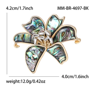 Elegant abalone shell lily flower brooch in gold finish with sparkling crystal center