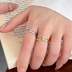 Minimalist S925 silver knot rings in gold and silver finish for women on book