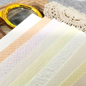 Assorted vintage specialty papers for scrapbooking with multi-texture and mixed colors