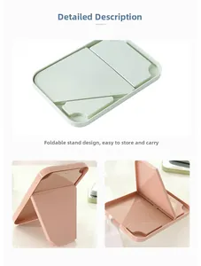 Detail view of foldable portable makeup mirrors with adjustable stands in pastel colors