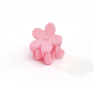 Close-up of pink flower hair claw clip with a matte finish for little girls' hairstyles