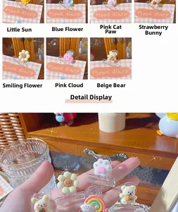 Close-up of cute cartoon acrylic binder clips featuring sun, rabbit, and bear designs