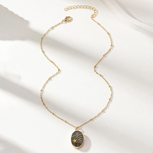 Elegant gold necklace featuring an oval purple amethyst pendant with golden star designs