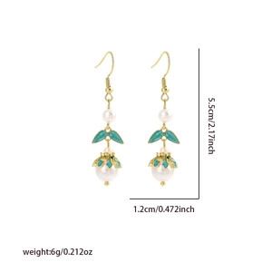 Detail view showing dimensions of 5.5cm elegant green leaf and pearl drop earrings