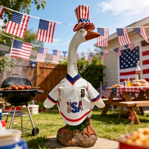 Detail of outdoor patriotic goose decor wearing a USA jersey and star-spangled hat