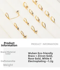 Detailed display of brass evil eye earrings with blue cubic zirconia on professional racks