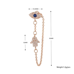 Detailed size view of rose gold Evil Eye and Hand of Fatima earring with blue zircon