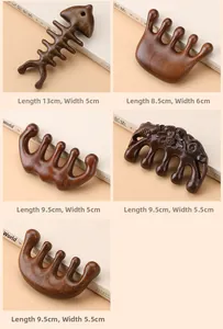 Detailed view of various sandalwood massage combs in dolphin and lotus hand shapes