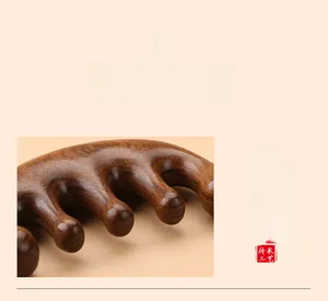 Detailed close-up of smooth round-tip wooden massage comb teeth for scalp care
