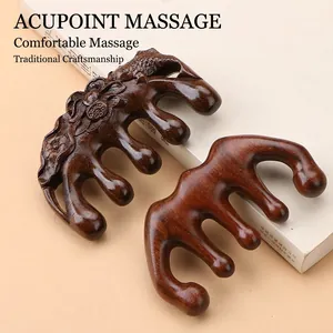 Handcrafted dolphin-shaped sandalwood meridian massage comb with carved lotus patterns