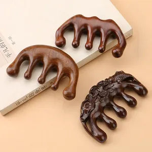 Polished sandalwood meridian massage comb set with elegant lotus fish carvings
