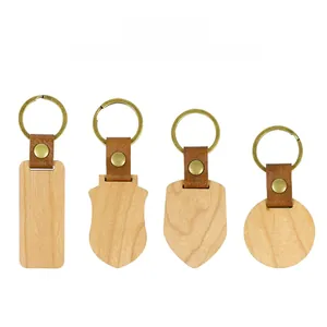 Detailed view of wood and leather keychains in rectangular, shield and round shapes