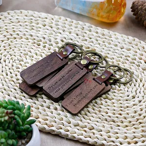 Vintage solid wood and PU leather keychains with engraved quotes and copper rings