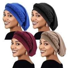 Ethnic turban caps in four colors featuring a thick braided trim on soft stretch knit fabric