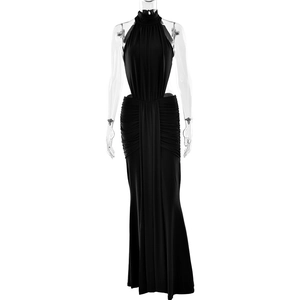 Detail of elegant black halter neck maxi dress with side cutouts and mermaid hemline