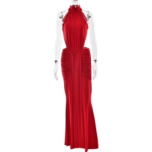 Detail of red halter neck evening gown featuring side waist cutouts and ruched mermaid skirt