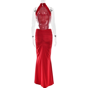 Detailed back view of a red ruched backless halter evening dress with a fishtail hemline