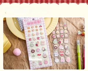 Detail view of MR.PAPER 3D foam dessert stickers with cute cat and donut illustrations