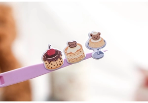 Detail of sweet foam stickers featuring 3D cartoon cakes and bear pudding models