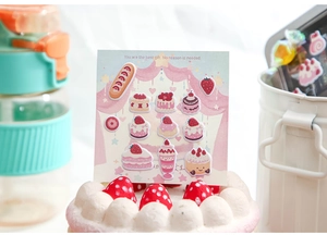 Close-up of 3D puffy dessert stickers with cute strawberry cake design for DIY journaling