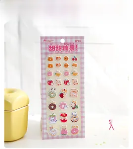 Detail of 3D puffy foam stickers featuring cute cat and dessert patterns for DIY scrapbooking
