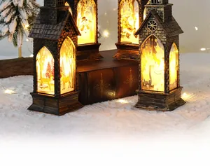 Close-up of four bronze vintage Christmas LED lanterns with warm glowing silhouettes