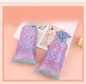 Close-up of mermaid scale pattern on purple and blue gradient gift wrapping bags