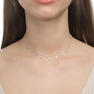 Detail of S925 sterling silver necklace featuring sparkling star and moon zircon charms