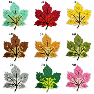 Detailed view of nine colorful maple leaf embroidery patches for clothing decoration