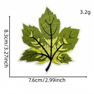 Macro view of a green maple leaf embroidery patch with detailed size and weight specs