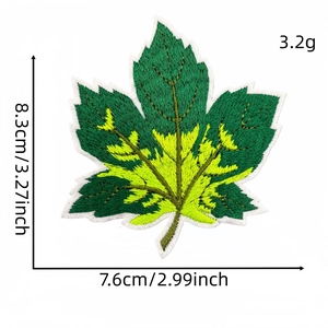 Green and yellow embroidered maple leaf patch with size and weight measurements